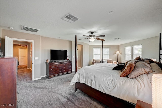 carpeted bedroom with a textured ceiling and ceiling fan