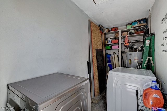 laundry area with water heater and separate washer and dryer