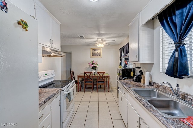 kitchen with white appliances, light tile patterned flooring, sink, ceiling fan, and white cabinets