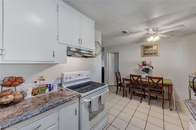 kitchen with a textured ceiling, electric range, ceiling fan, white cabinets, and light tile patterned floors