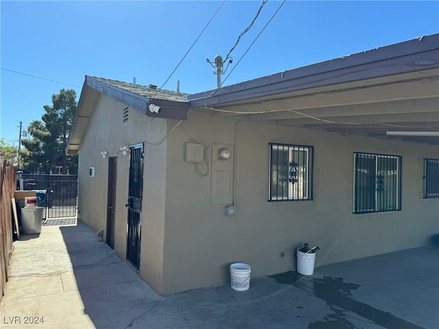 view of side of home featuring a patio