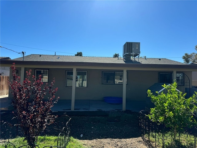 rear view of house with a patio and central AC unit