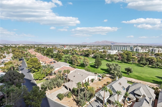 birds eye view of property with a mountain view