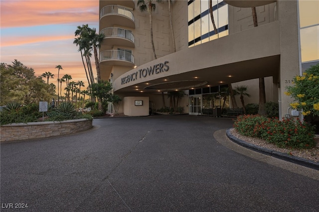 view of outdoor building at dusk