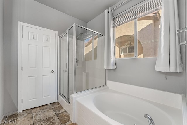 bathroom with separate shower and tub