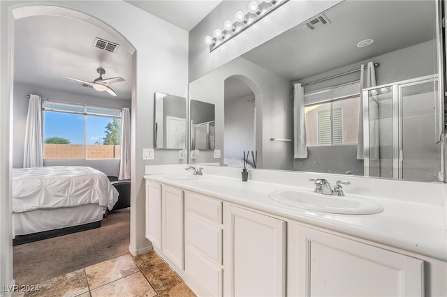 bathroom with ceiling fan, tile patterned flooring, vanity, and a shower with shower door