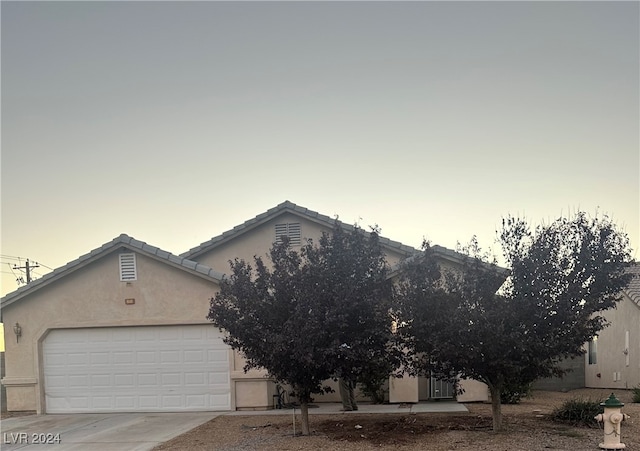 view of front of property with a garage