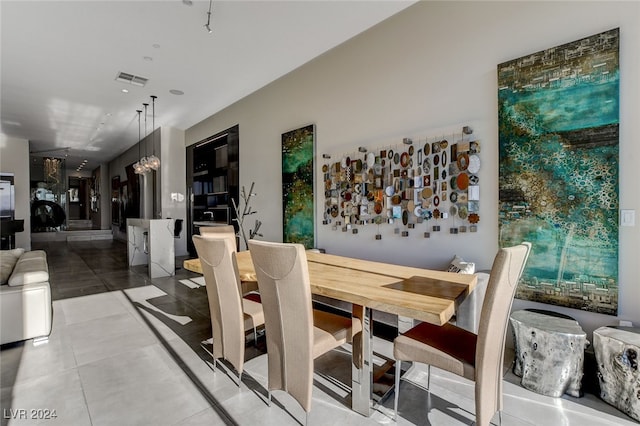 dining area with an inviting chandelier