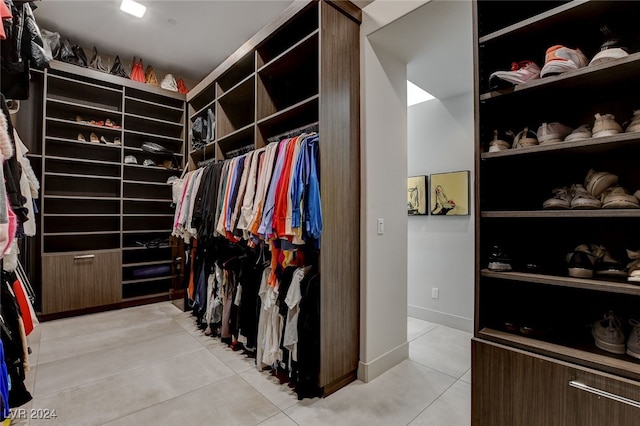 spacious closet with light tile patterned flooring