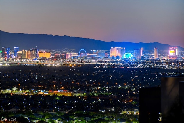 property's view of city with a mountain view