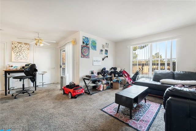 living room with carpet floors and ceiling fan