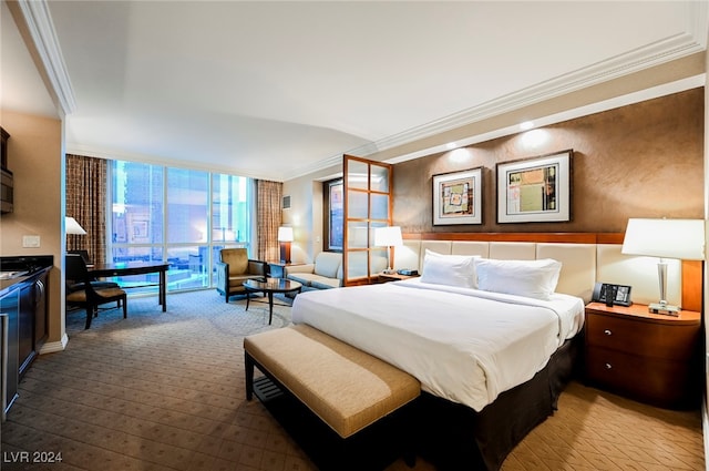 bedroom featuring floor to ceiling windows and crown molding