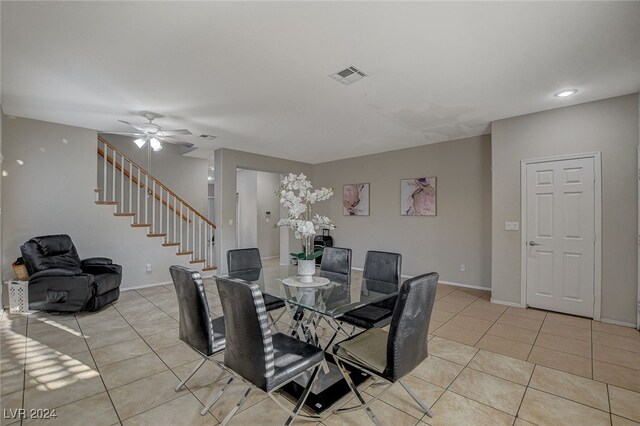 tiled dining room with ceiling fan