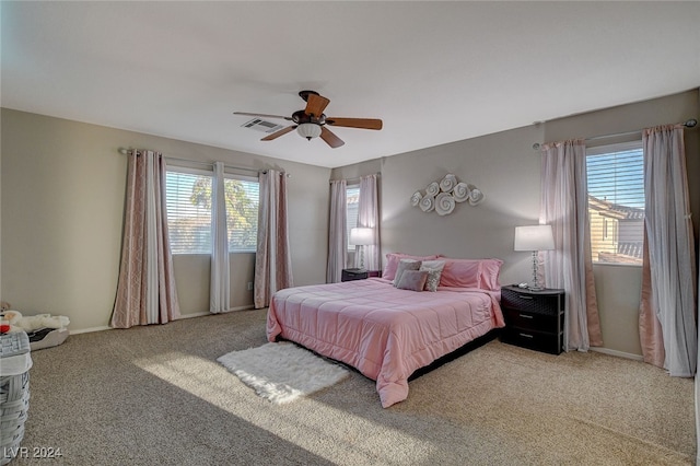 carpeted bedroom featuring ceiling fan