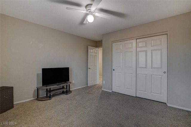 unfurnished bedroom featuring baseboards, carpet flooring, and ceiling fan