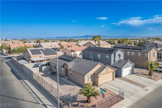 birds eye view of property featuring a mountain view