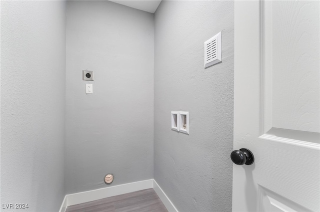 laundry area featuring hardwood / wood-style flooring, hookup for a washing machine, and electric dryer hookup