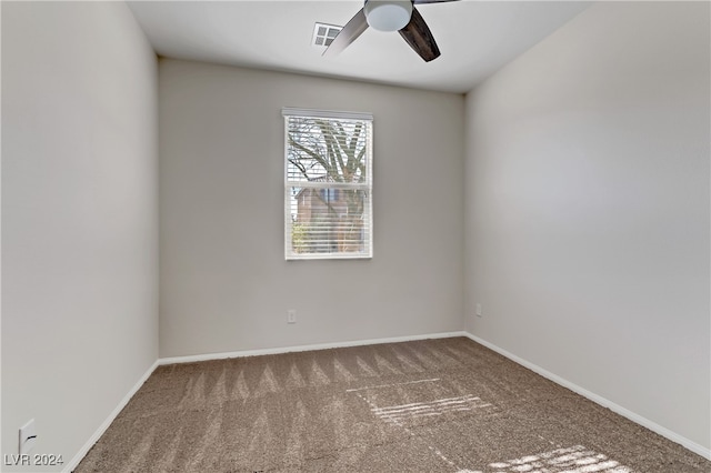 spare room with ceiling fan and carpet floors