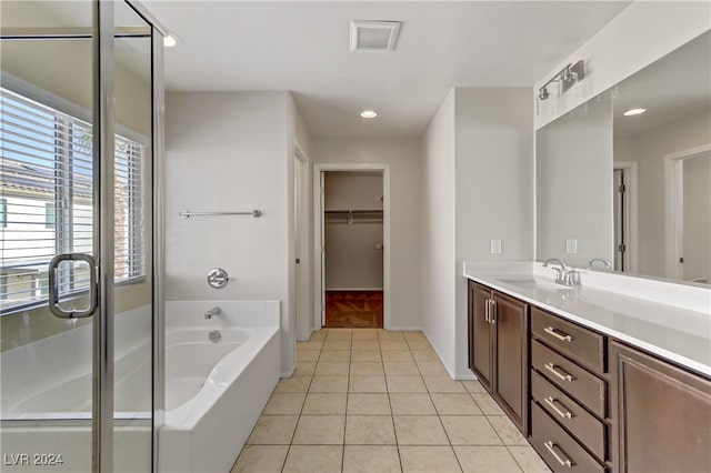 bathroom with vanity, tile patterned floors, and independent shower and bath