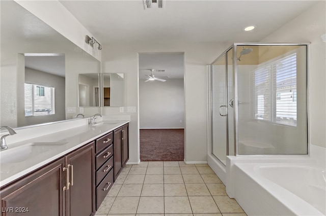 bathroom featuring vanity, plus walk in shower, and plenty of natural light