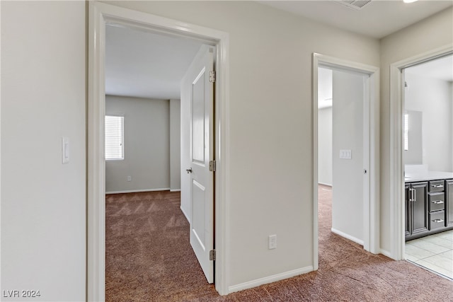 corridor with light carpet