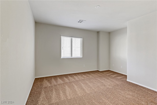 unfurnished room featuring carpet