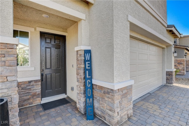 property entrance featuring a garage