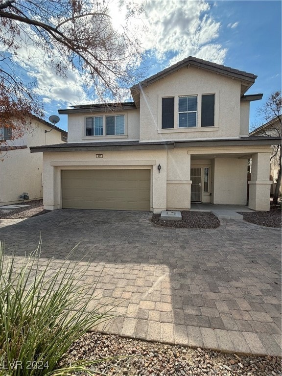 front of property featuring a garage