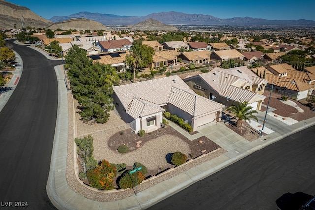 birds eye view of property featuring a mountain view