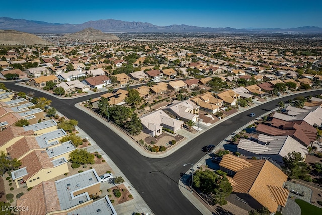 birds eye view of property with a mountain view