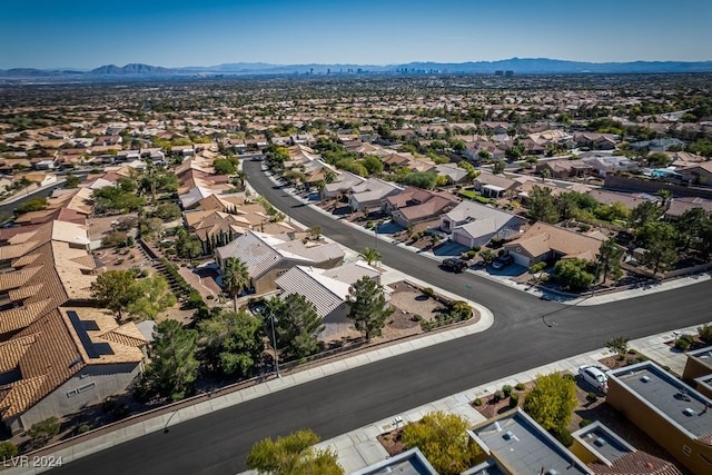 birds eye view of property with a mountain view