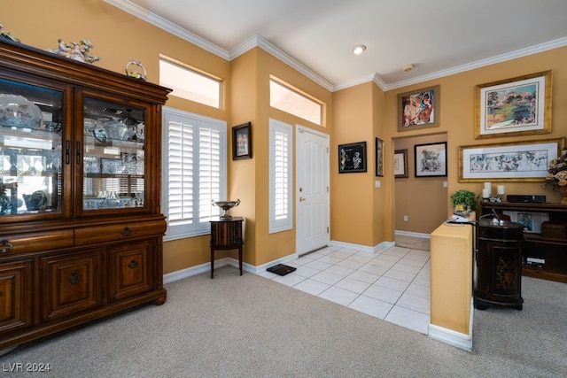 carpeted foyer entrance with crown molding