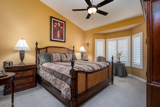 carpeted bedroom featuring lofted ceiling and ceiling fan