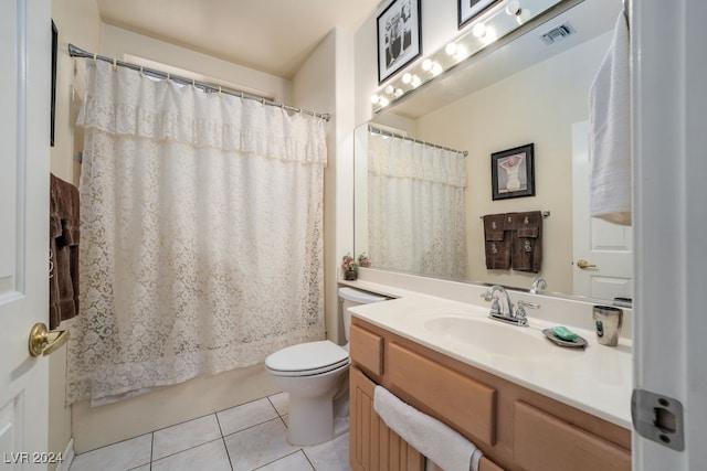 full bathroom featuring shower / bath combo, vanity, tile patterned flooring, and toilet