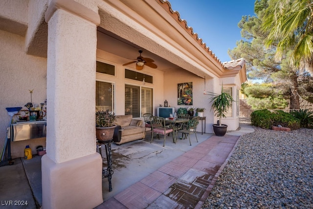 view of patio featuring ceiling fan