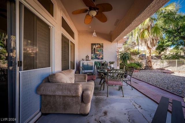 view of patio featuring ceiling fan and an outdoor living space