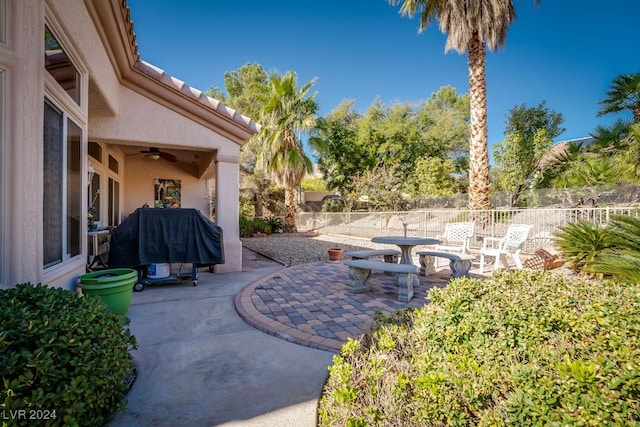 view of patio with grilling area and ceiling fan