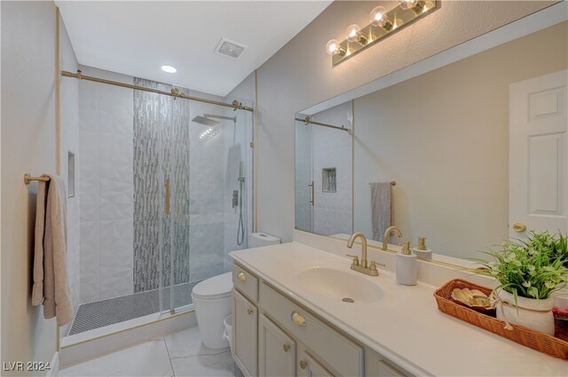 bathroom with vanity, toilet, and walk in shower