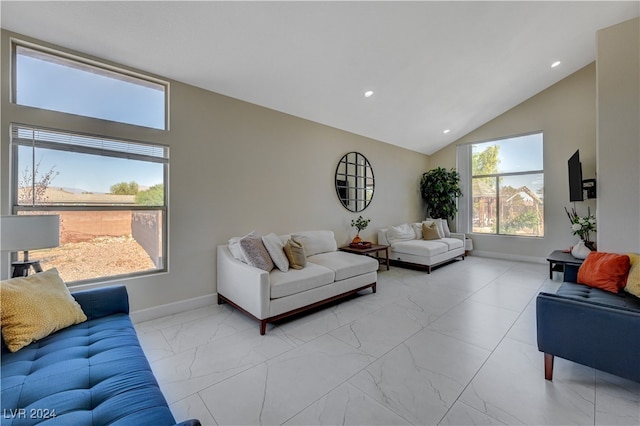 living room with high vaulted ceiling