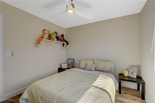 bedroom with ceiling fan and light hardwood / wood-style flooring