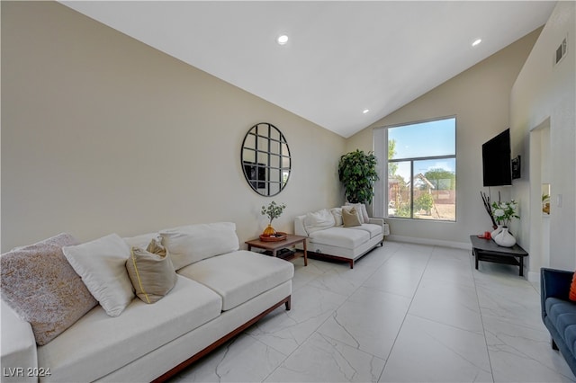 living room with high vaulted ceiling