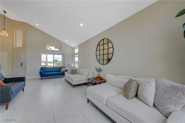 living room featuring high vaulted ceiling