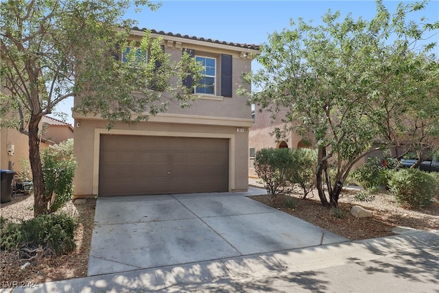 view of front of property with a garage