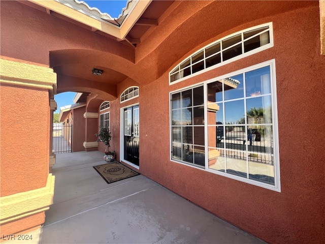 doorway to property with a patio area