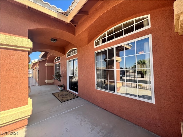 doorway to property featuring a patio