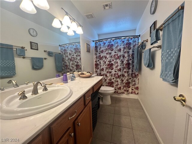 bathroom featuring vanity, tile patterned flooring, toilet, and a shower with shower curtain