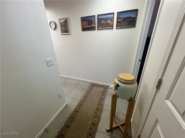 corridor featuring light tile patterned floors