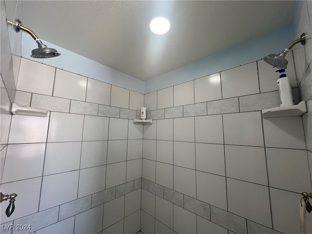 bathroom with tiled shower