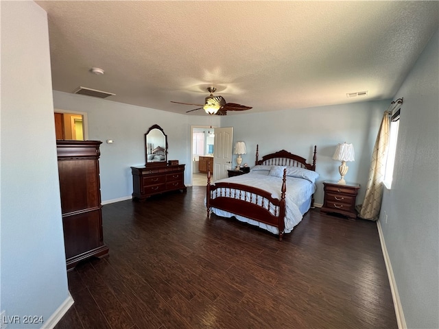 bedroom with ceiling fan, dark hardwood / wood-style floors, and a textured ceiling