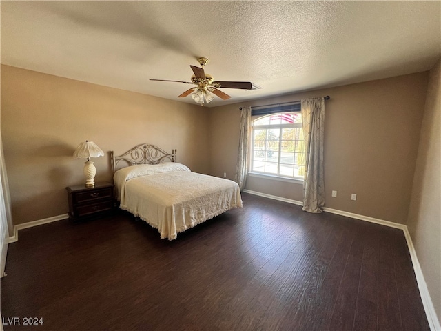 bedroom featuring ceiling fan and dark hardwood / wood-style floors